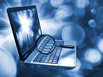 laptop with a magnifying glass