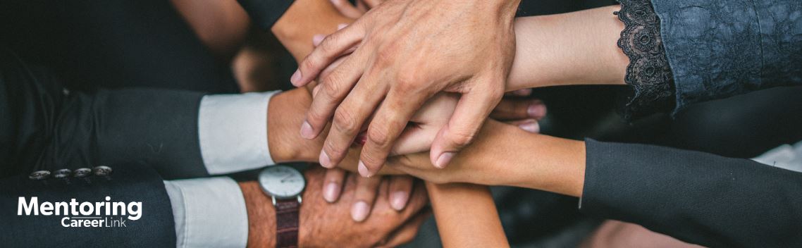 Career professionals stacking hands