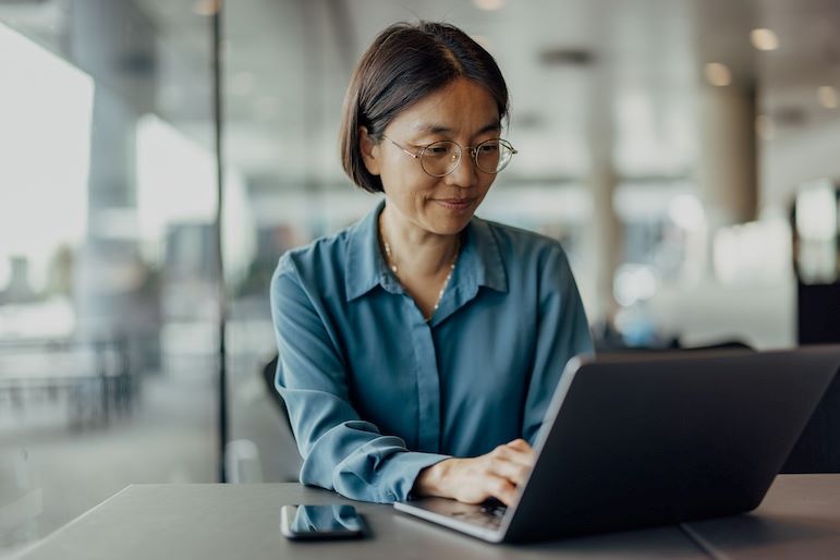 certified Microsoft office specialist typing on laptop