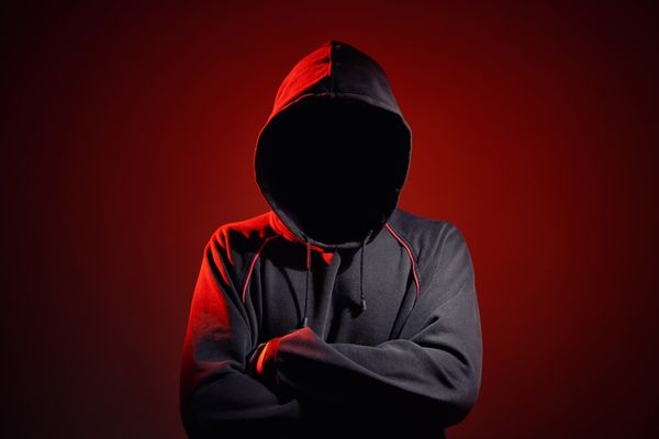 cybercrime hooded figure