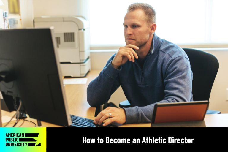 athletic director looking at computer