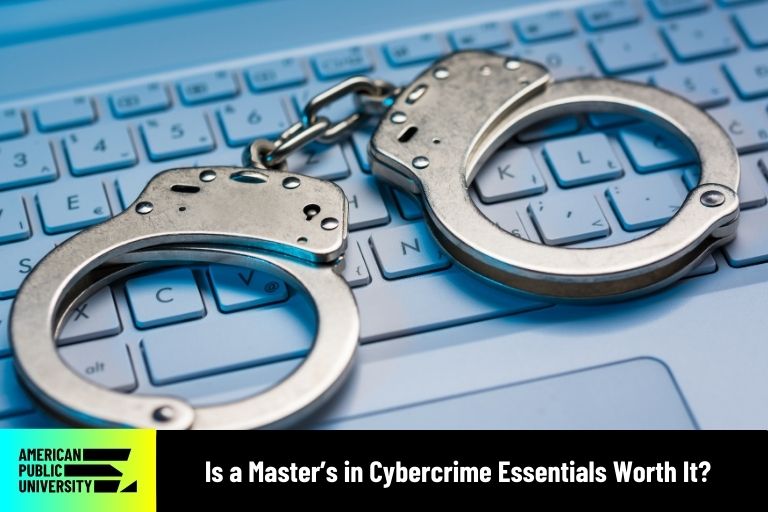 is-a-masters-in-cybercrime-essentials-worth-it handcuffs on keyboard