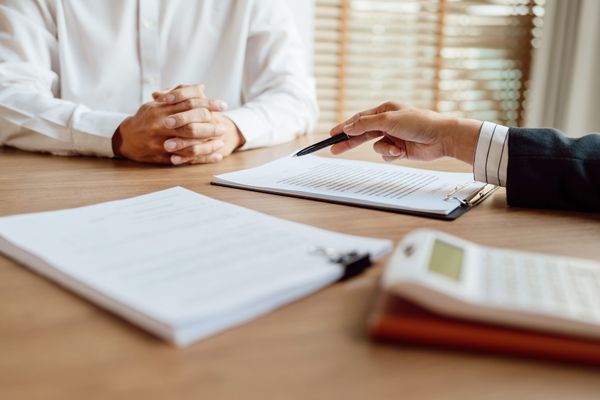 masters in health management student speaking with professor