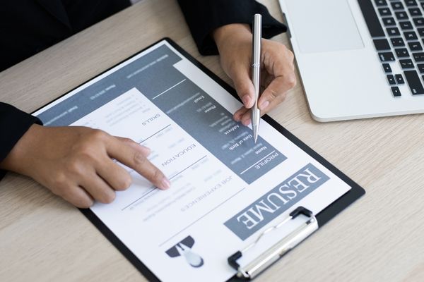 human resource professional looking at resume