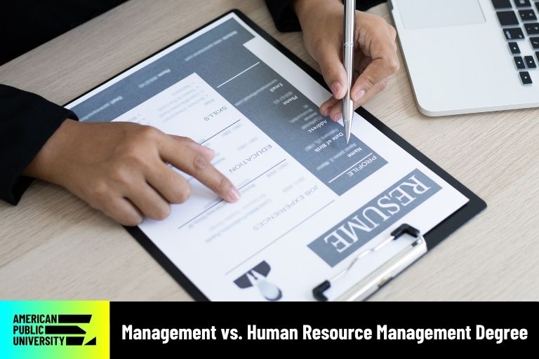 management-vs-human-resource-management-degree human resource professional looking at resume