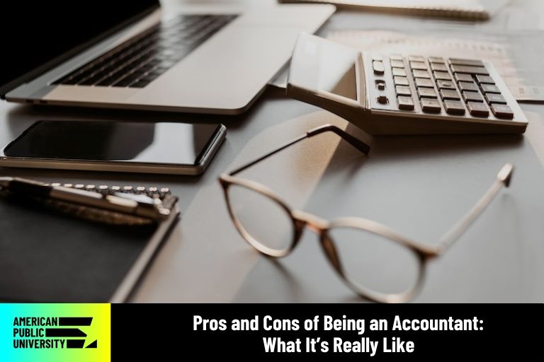 accountant calculator by laptop