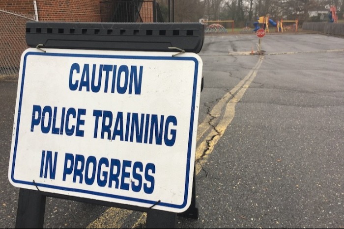 police training in progress sign