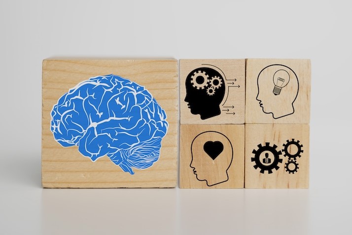 psychology icons printed on wooden blocks