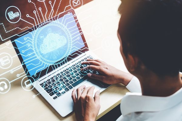 computer technology degree student on laptop