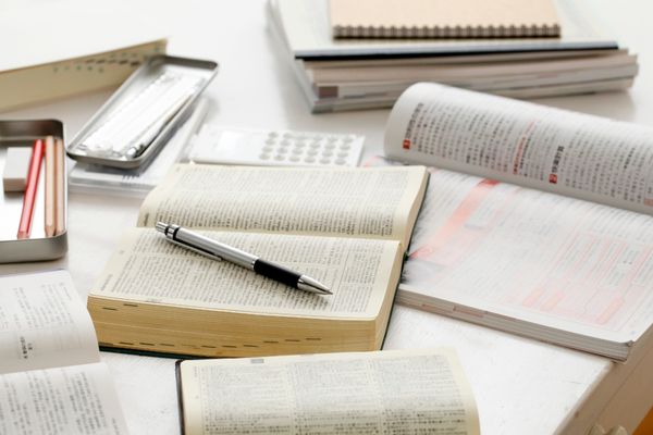 general studies textbook with pen