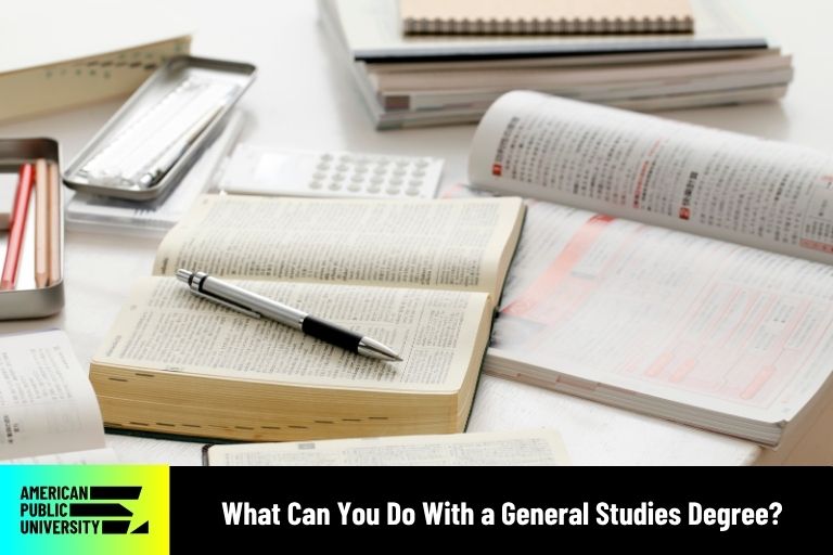 general studies textbook with pen