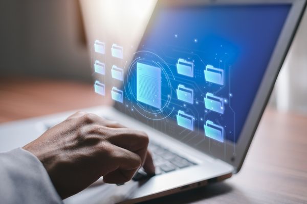 health information management student on laptop