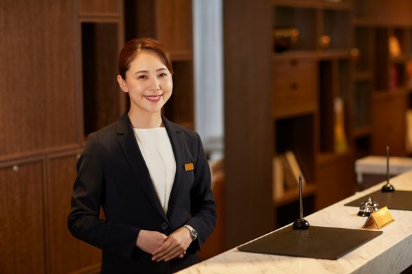 Hospitality Management degree graduate working in hotel