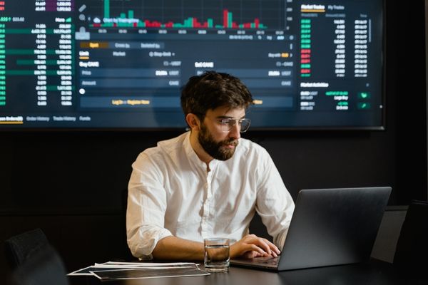 intelligence analyst typing on laptop