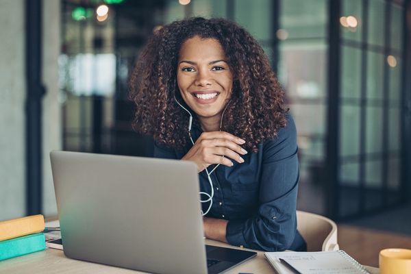 BA in Management student working on laptop