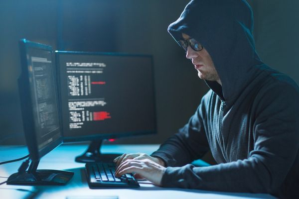 cyber criminal on computer