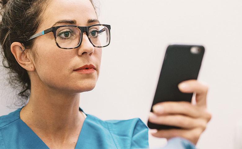 Nurse Looking at Phone